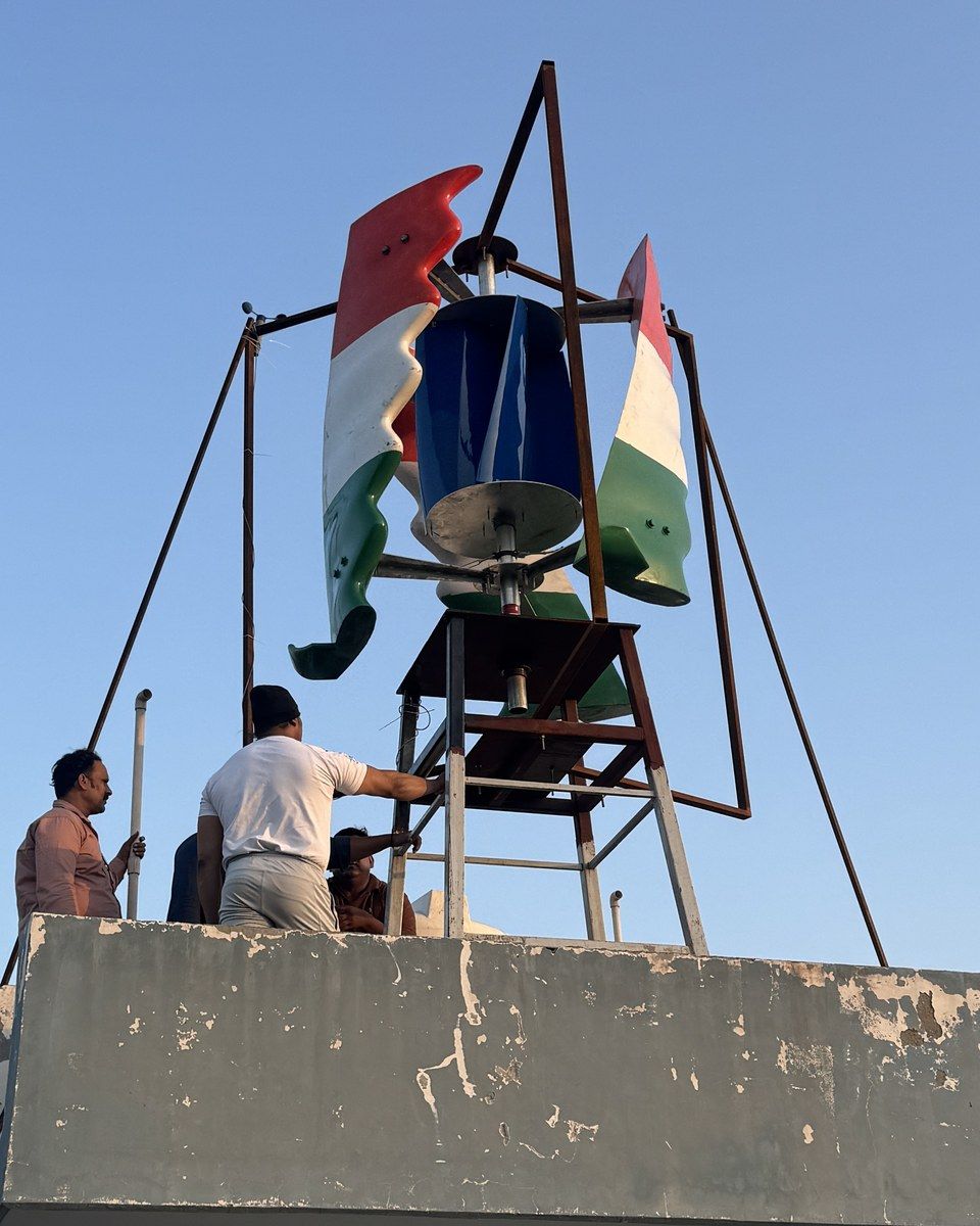 The complete tricolour GIVARA ONE on its rooftop stand with the crew at the parapet, 29 September 2026.
